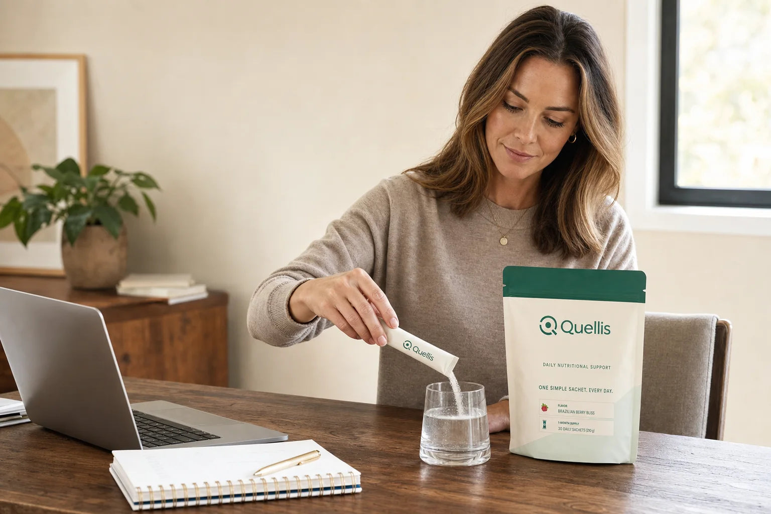 Quellis beside a laptop as part of a workday routine